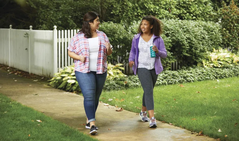 Family walking to help be healthy